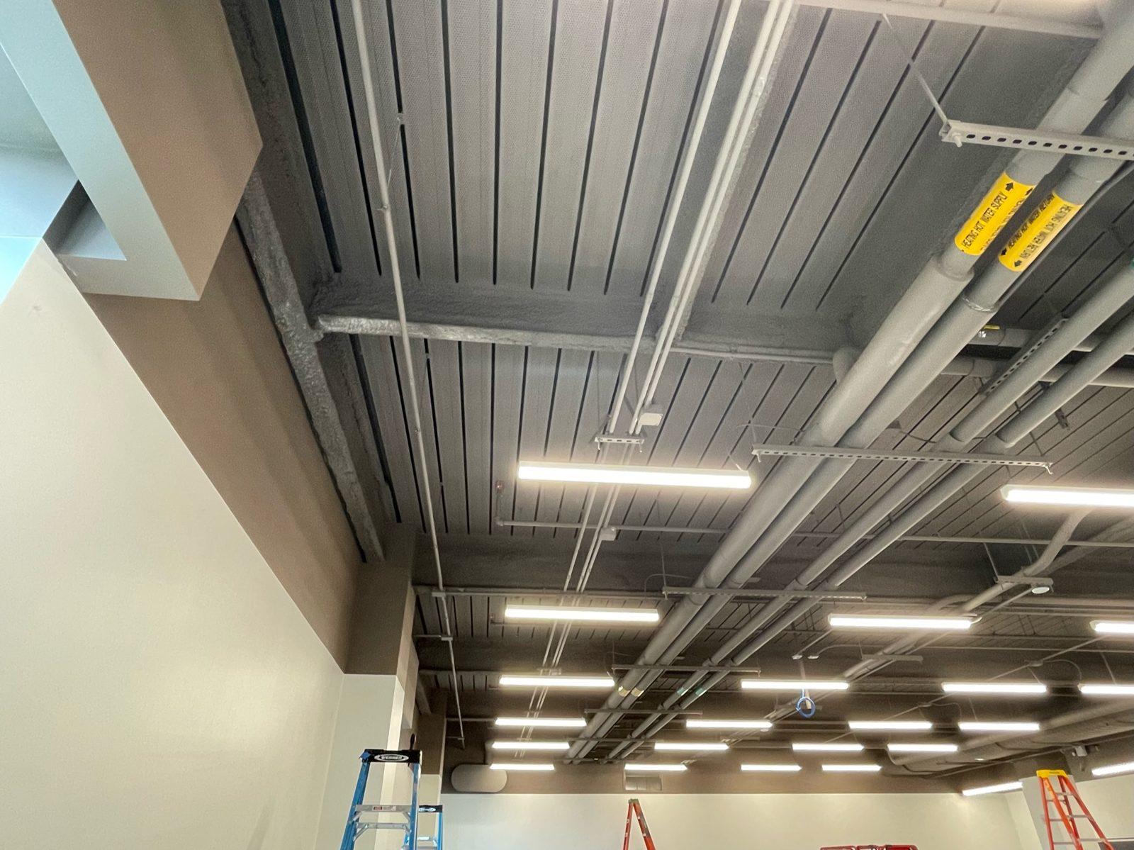 Before: The open ceiling and bare walls of the room before any track or netting. Custom Indoor Drone Enclosure Installed at Brown University