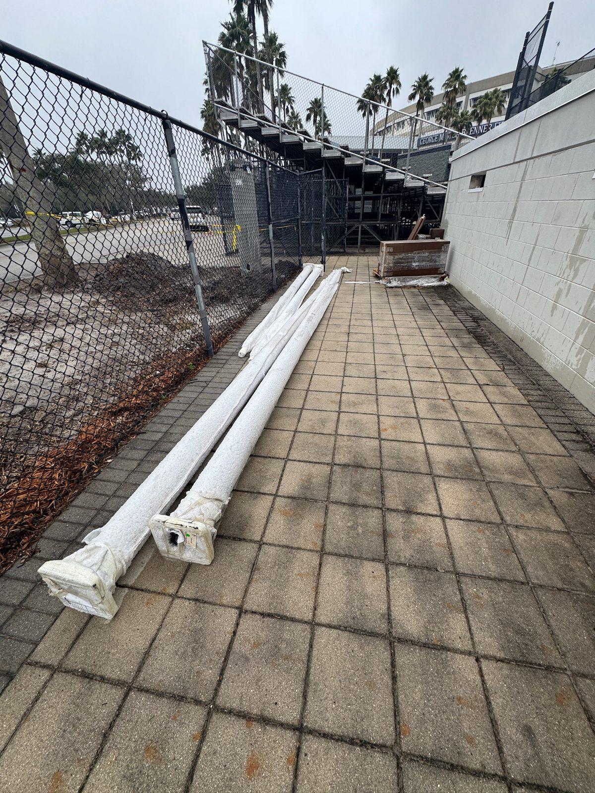 During: New aluminum poles delivered and staged beside the bleachers. Pole Setting at George M. Steinbrenner Field in Tampa