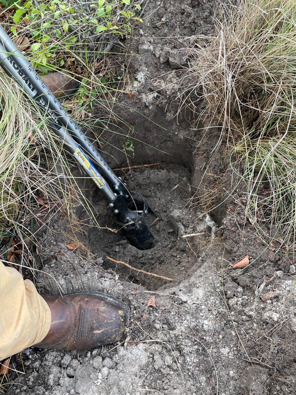 During: Hole dug out in the landscaped island. Pole Setting at Indian Shores Municipal Center