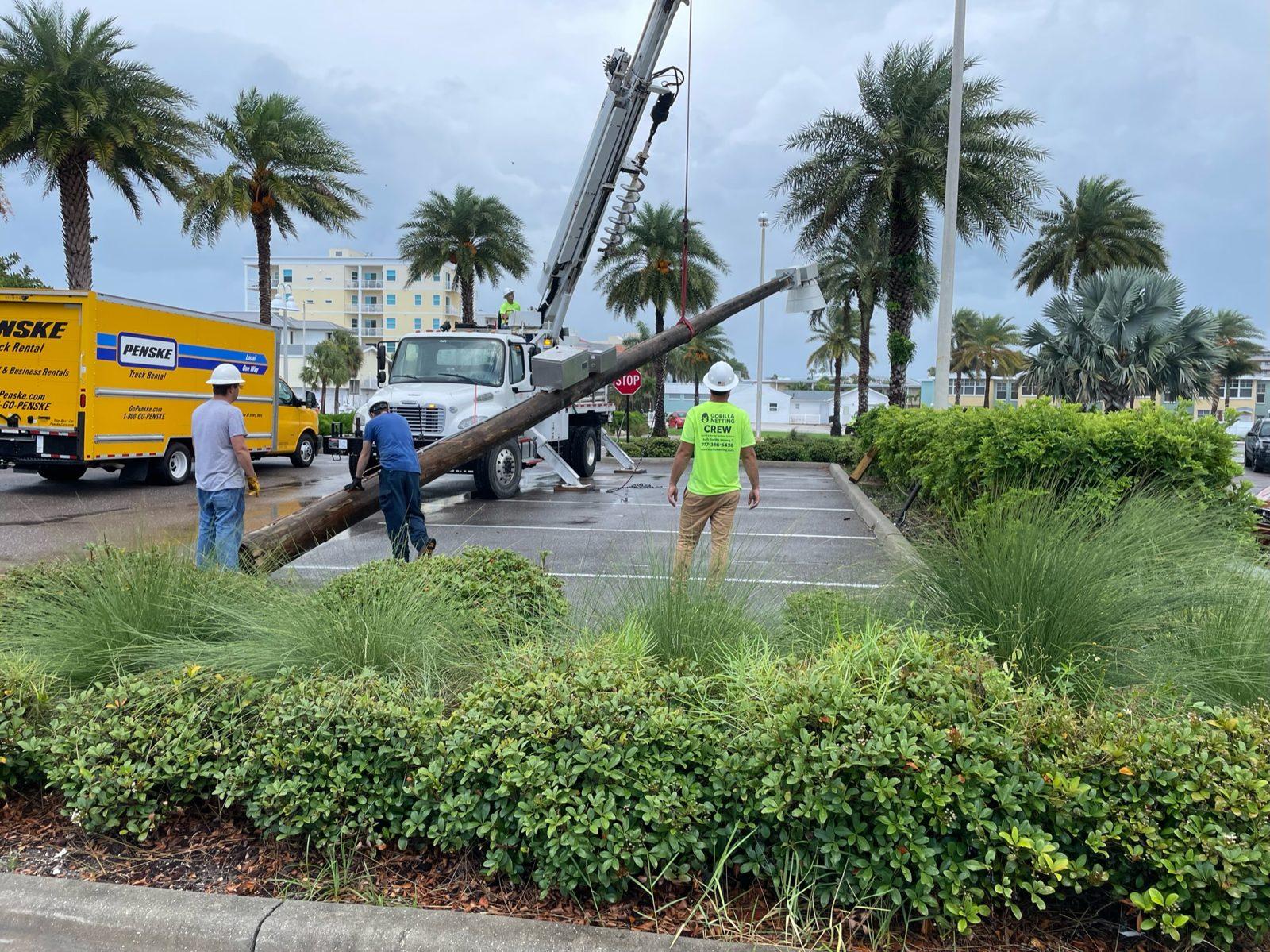 During: Crew raising the pole into place. Pole Setting at Indian Shores Municipal Center
