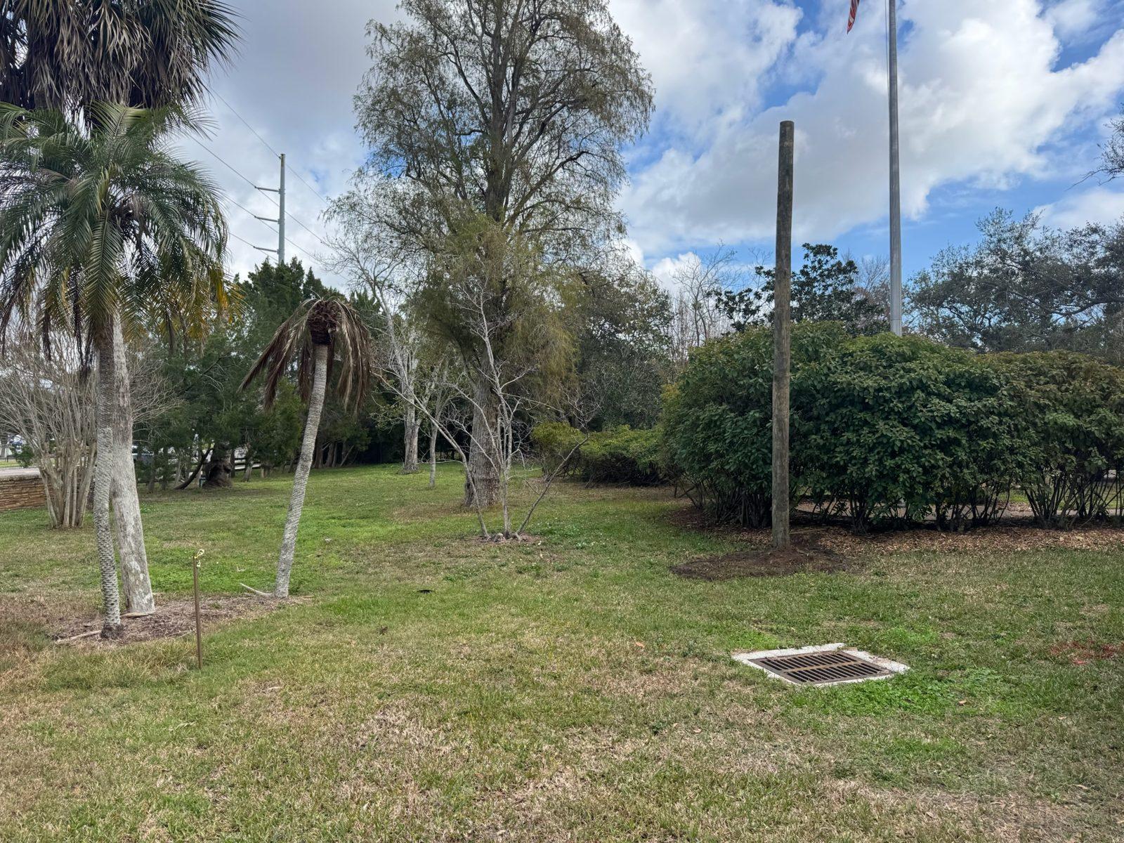 After: Same entrance with the new wood pole set. Park Entrance Pole Setting Across Pinellas County
