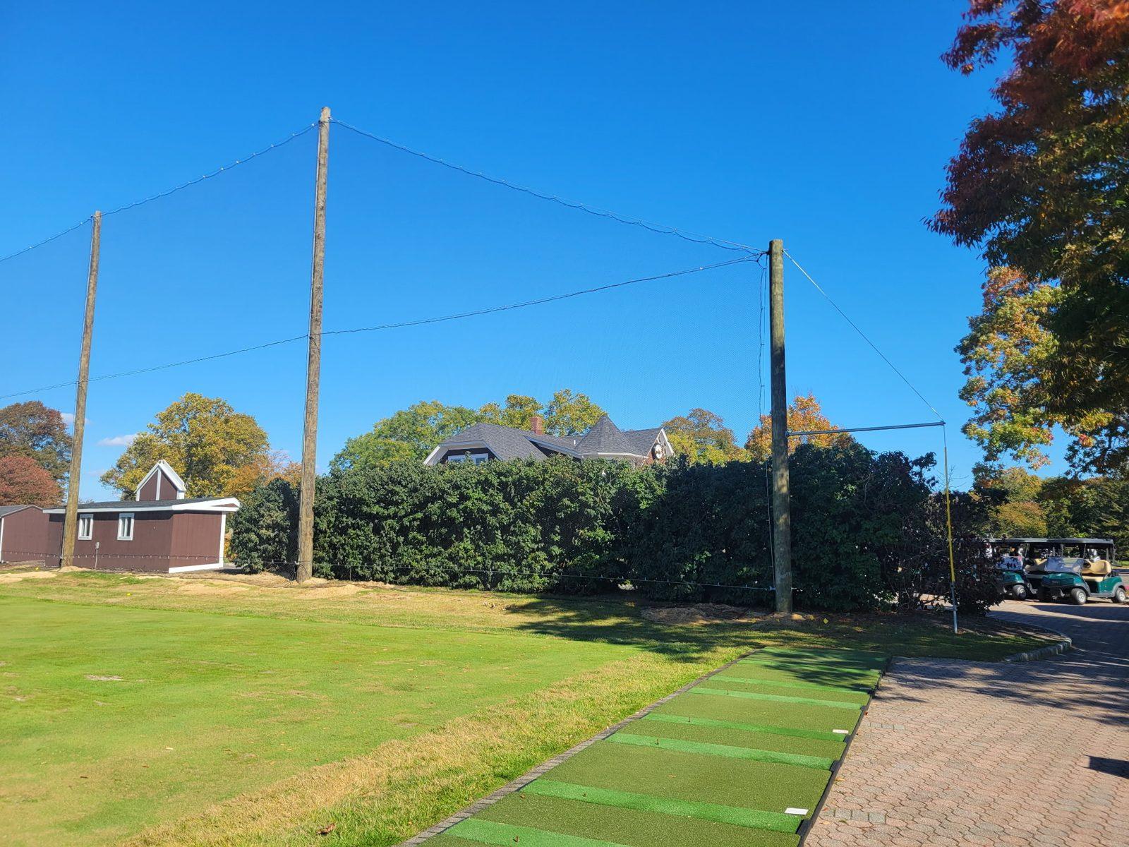 After: Finished netting on new wood poles at the clubhouse end of the range. Driving Range Netting at Southward Ho Country Club