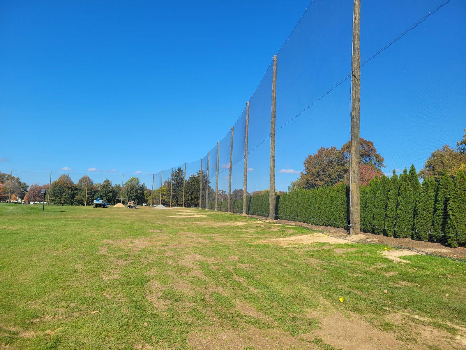 Before: Old barrier beside the practice tee and clubhouse. Driving Range Netting at Southward Ho Country Club