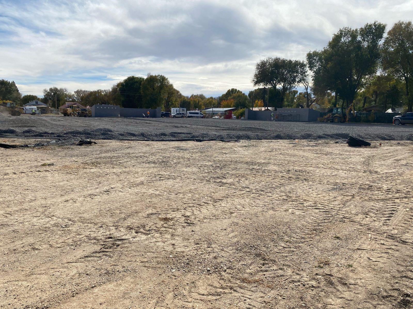 Before: Graded dirt and gravel base at the new field, block walls by others already up, no poles yet. Perimeter Netting at West Las Vegas Middle School