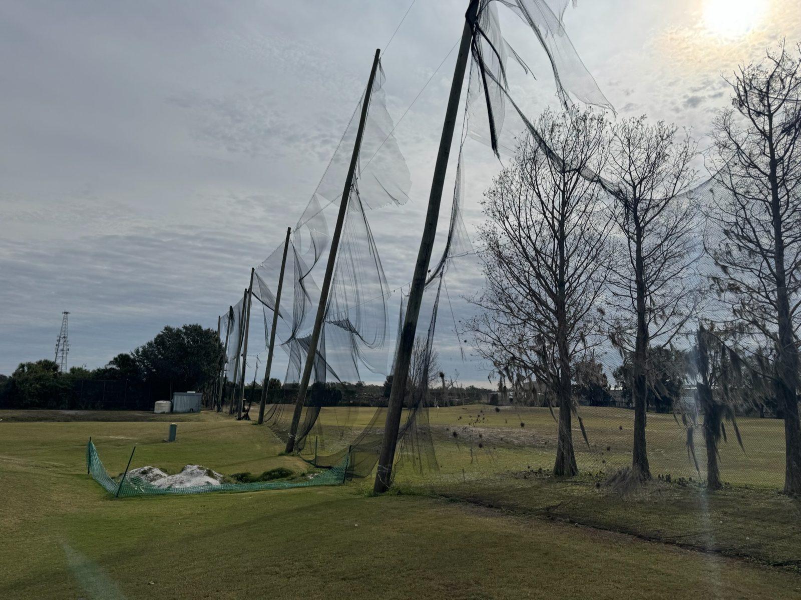Before: Leaning poles and torn, sagging net panels. Perimeter Netting Replacement at the YMCA Par 3 Course in Lakeland