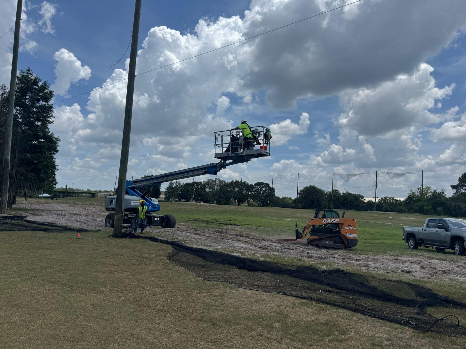 During: Net panel being raised from the lift. Perimeter Netting Replacement at the YMCA Par 3 Course in Lakeland
