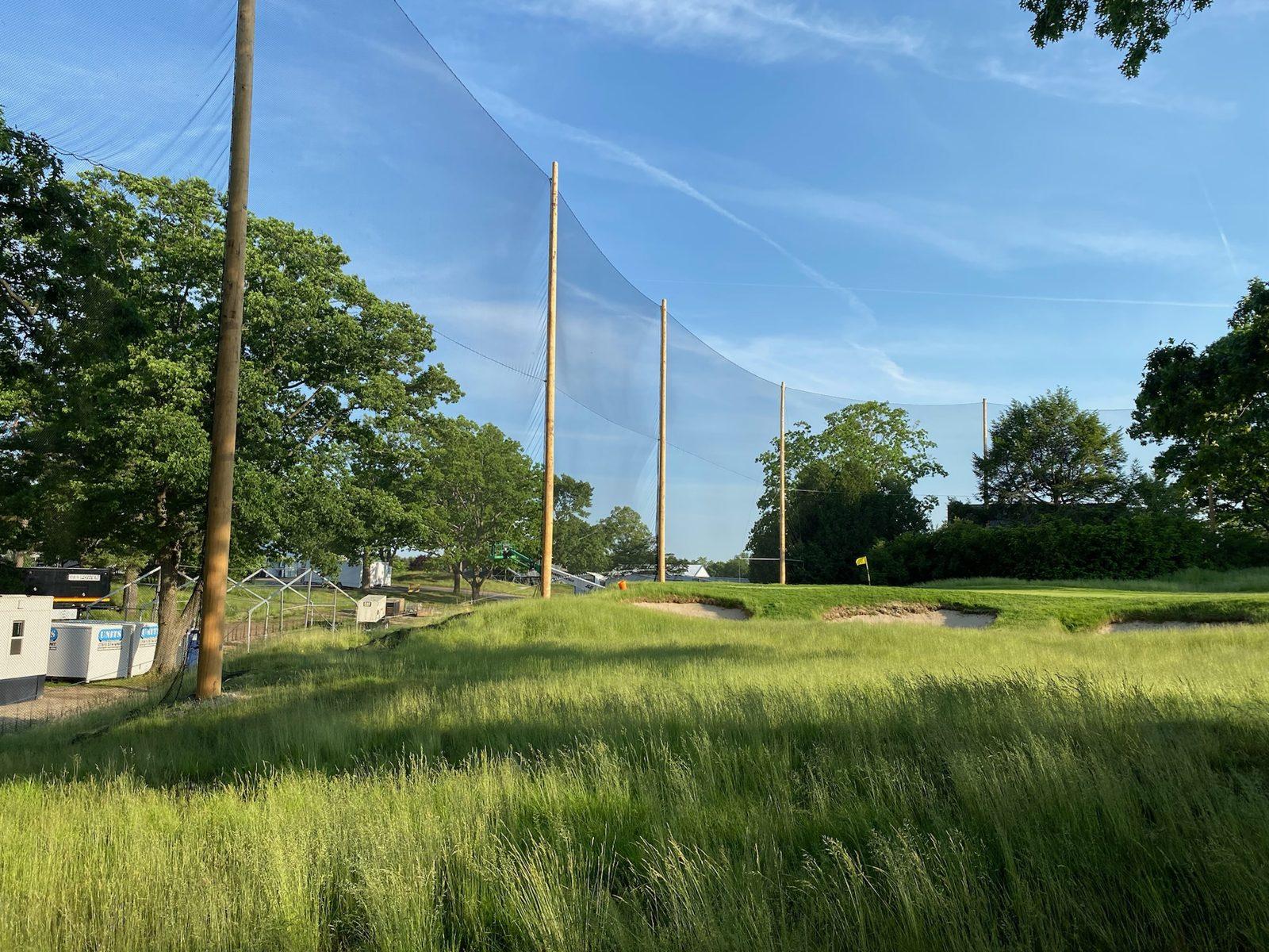 Before: Open fairway and tee area in early spring, before any poles went in. Golf Course Netting at The Country Club, Brookline