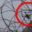 Example of drone flying over barbed wire fence