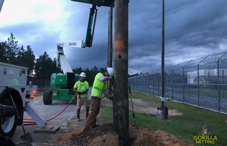 Gorilla Netting Crew Installing Poles for an Anti-Contraband Security Perimeter Netting System
