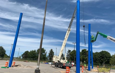 Crew Installs Poles at Netted Drone Enclosure Installation at University at Buffalo, by Gorilla Netting