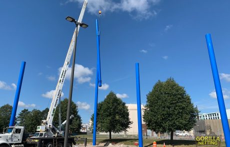 Crew Installs Poles at Netted Drone Enclosure Installation at University at Buffalo, by Gorilla Netting